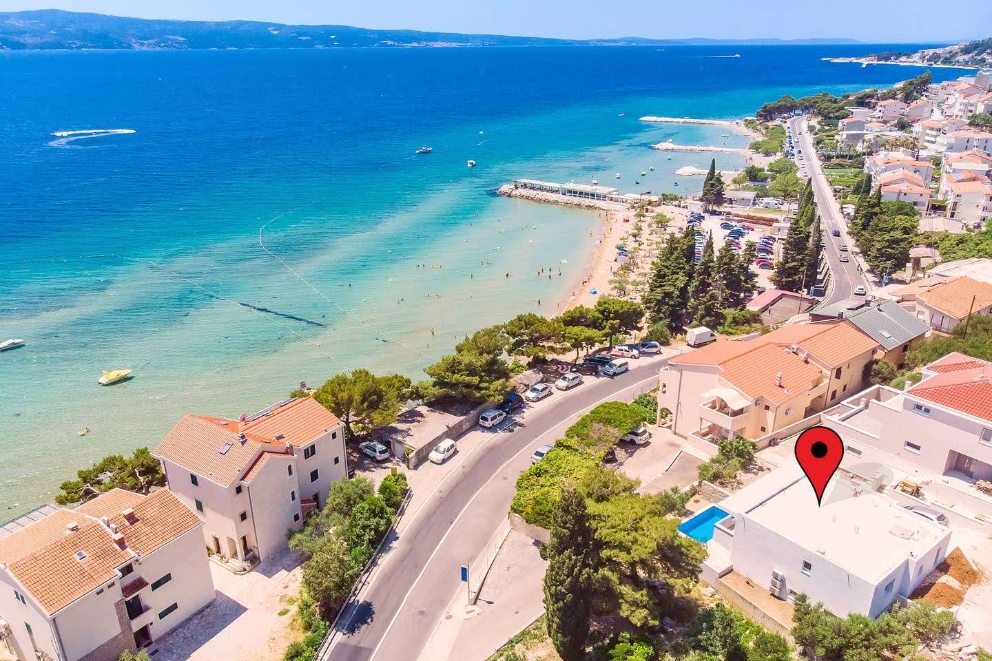 Aerial view of the coastline showing the villa's location near the beach